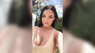Angela walks for us again. Her top can hardly hold her breasts in.