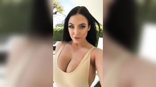 Braless in Motion: Angela walks for us again. Her top can hardly hold her breasts in. #4