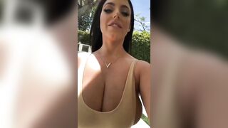 Braless in Motion: Angela walks for us again. Her top can hardly hold her breasts in. #3