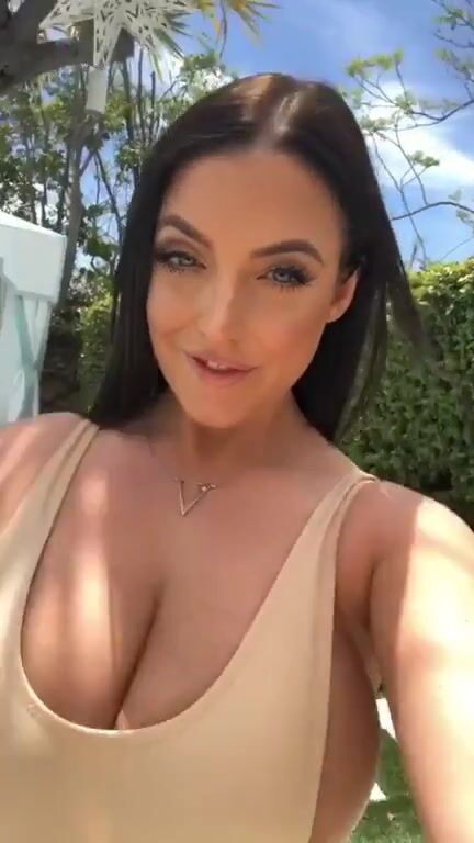 Angela walks for us again. Her top can hardly hold her breasts in