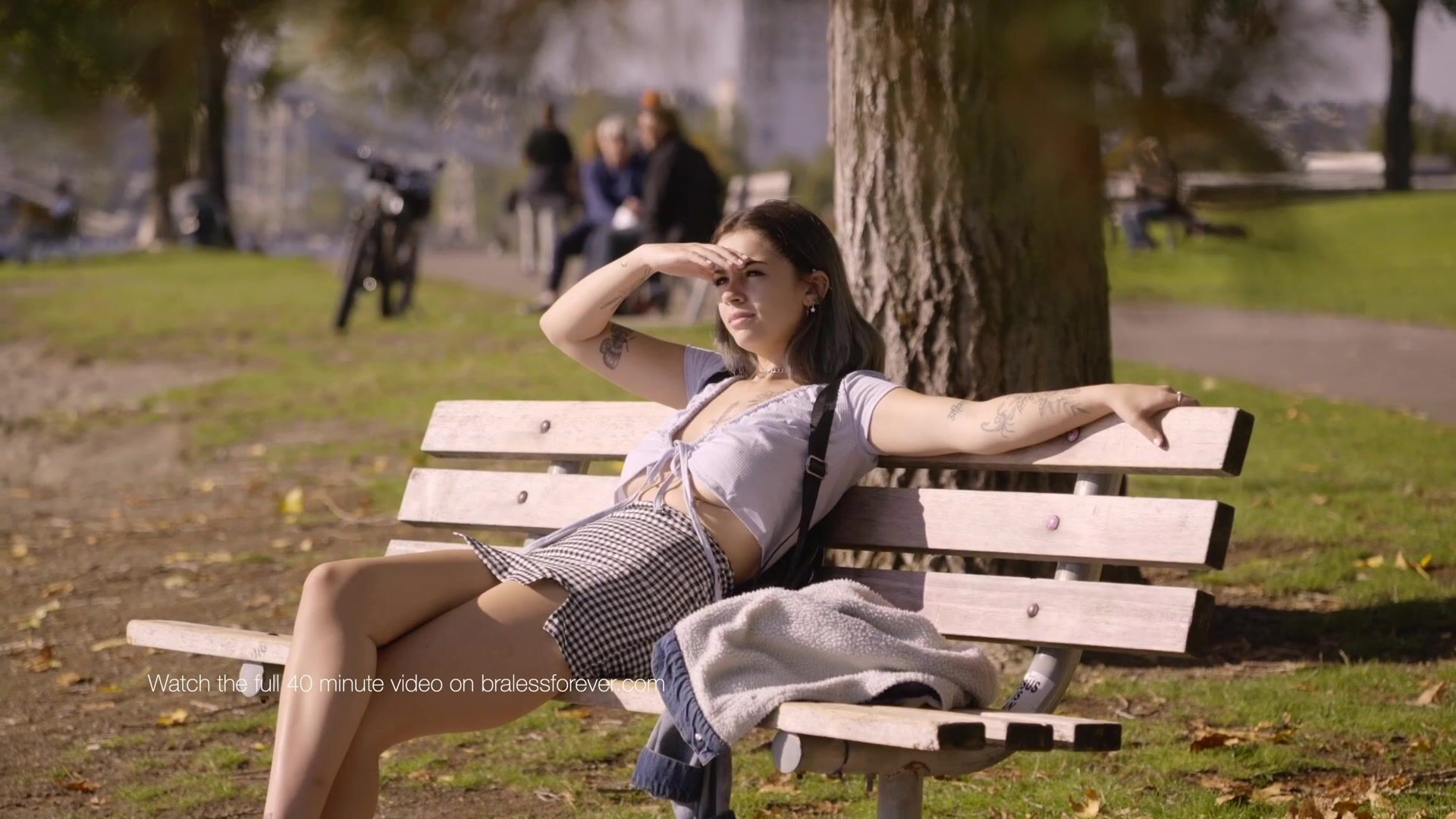 The beautiful Bella on a bench in a park