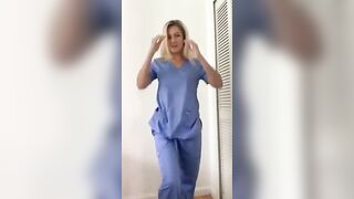 Blonde nurse removes her top