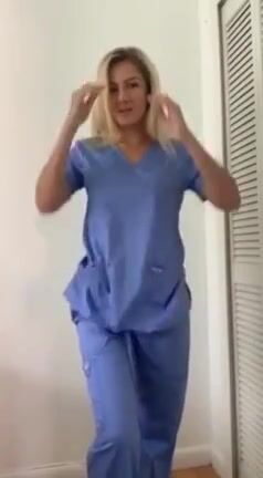 Blonde nurse removes her top
