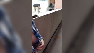 Tits on a balcony